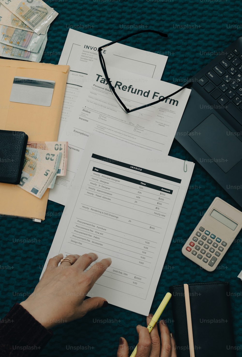 a person is filling out a tax return form