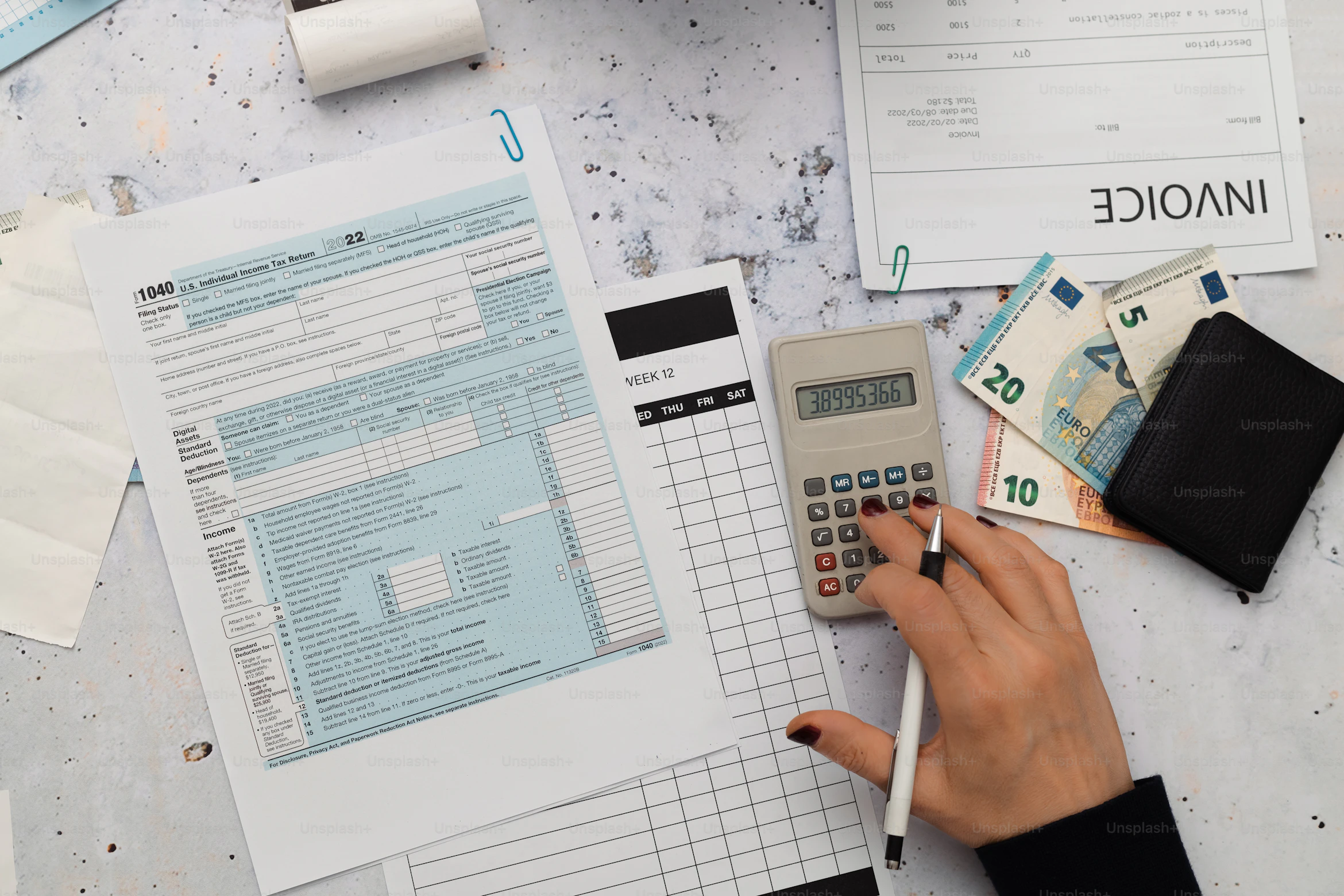 Person reviewing recurring subscription expenses on a laptop