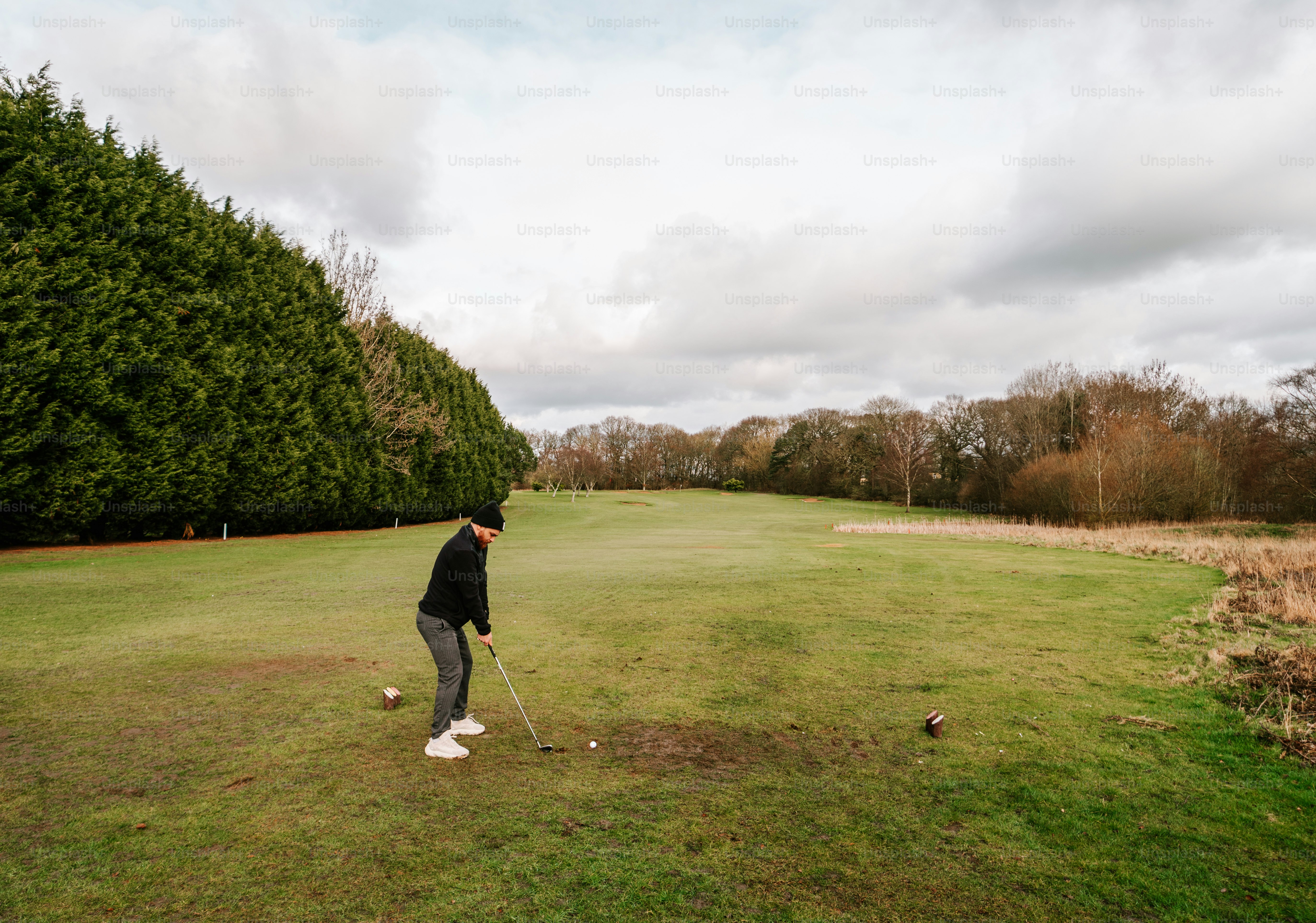 a man playing golf on a golf course