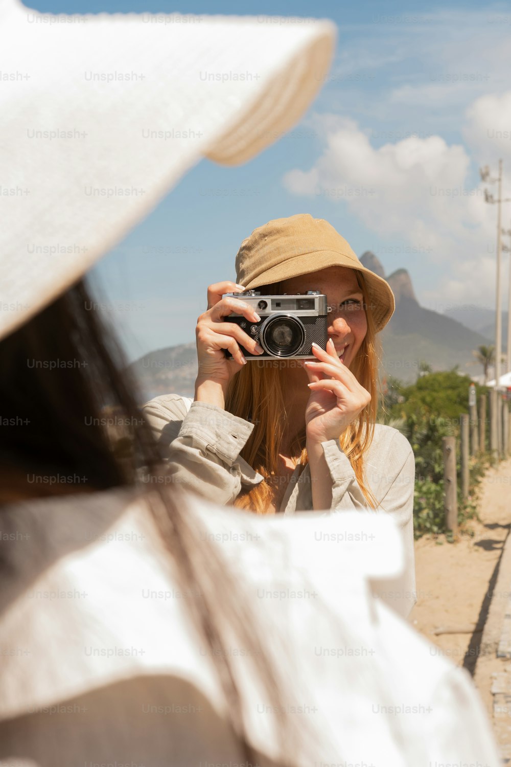 a woman taking a picture of herself with a camera