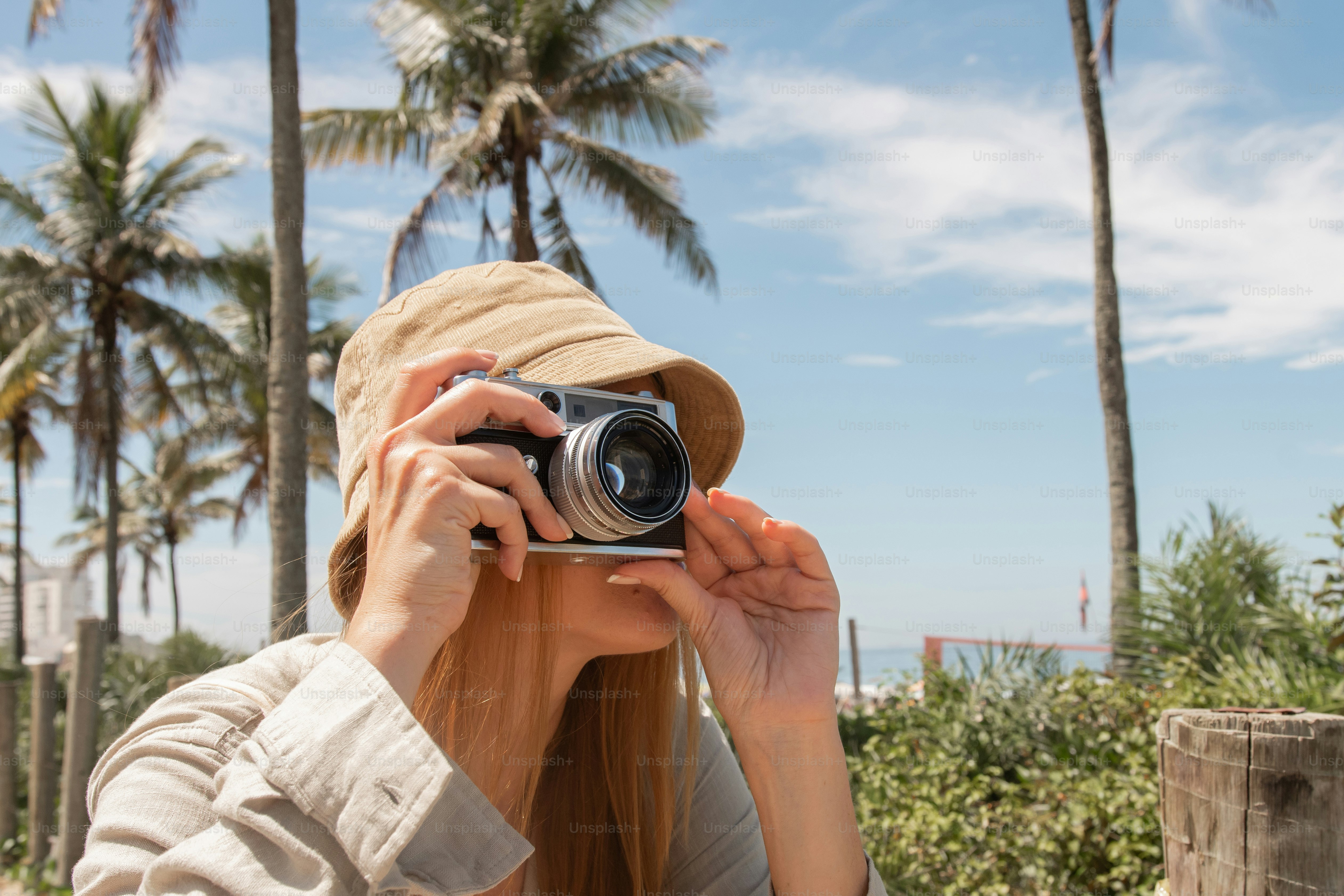 a woman taking a picture with a camera