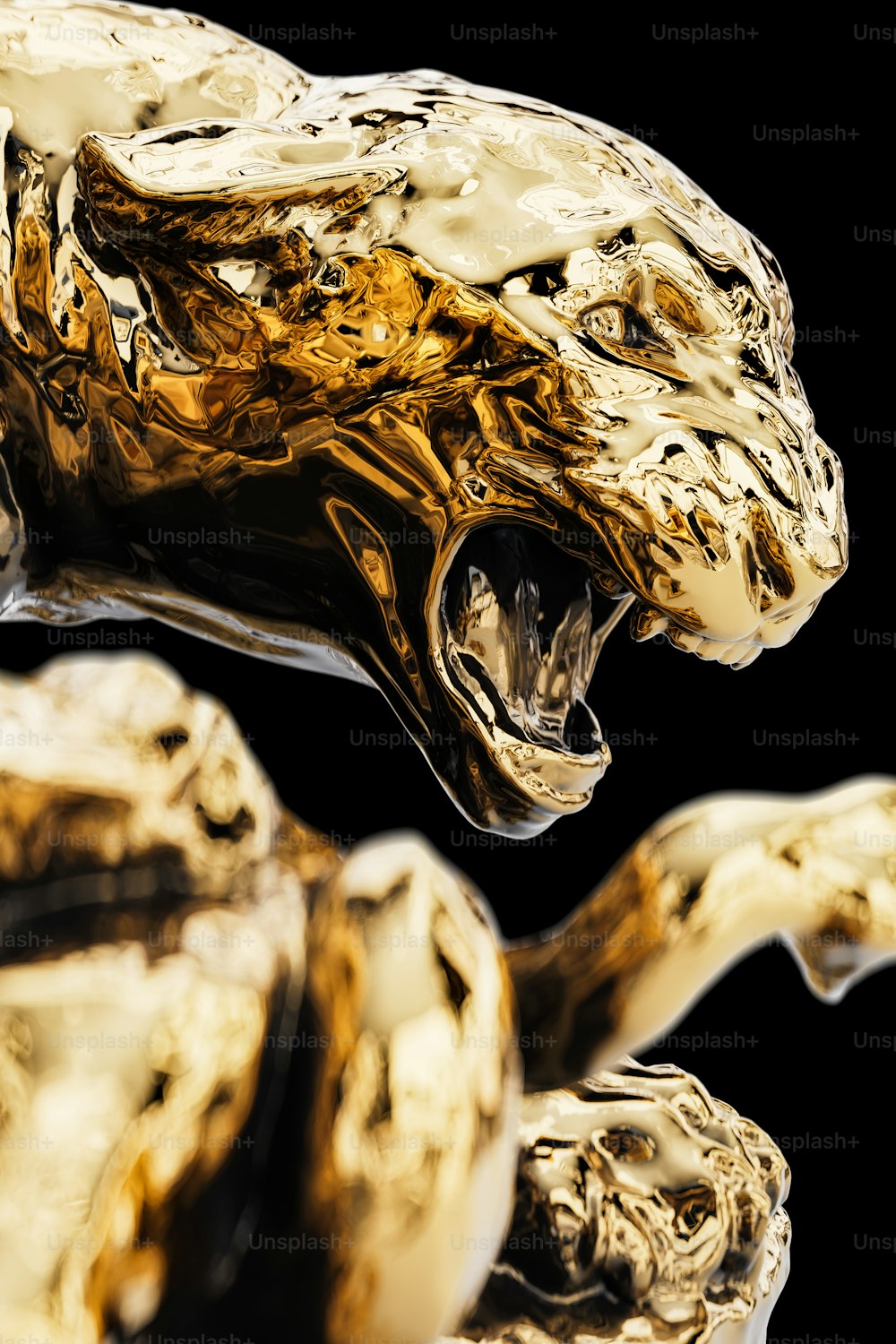 a close up of a gold sculpture of a leopard