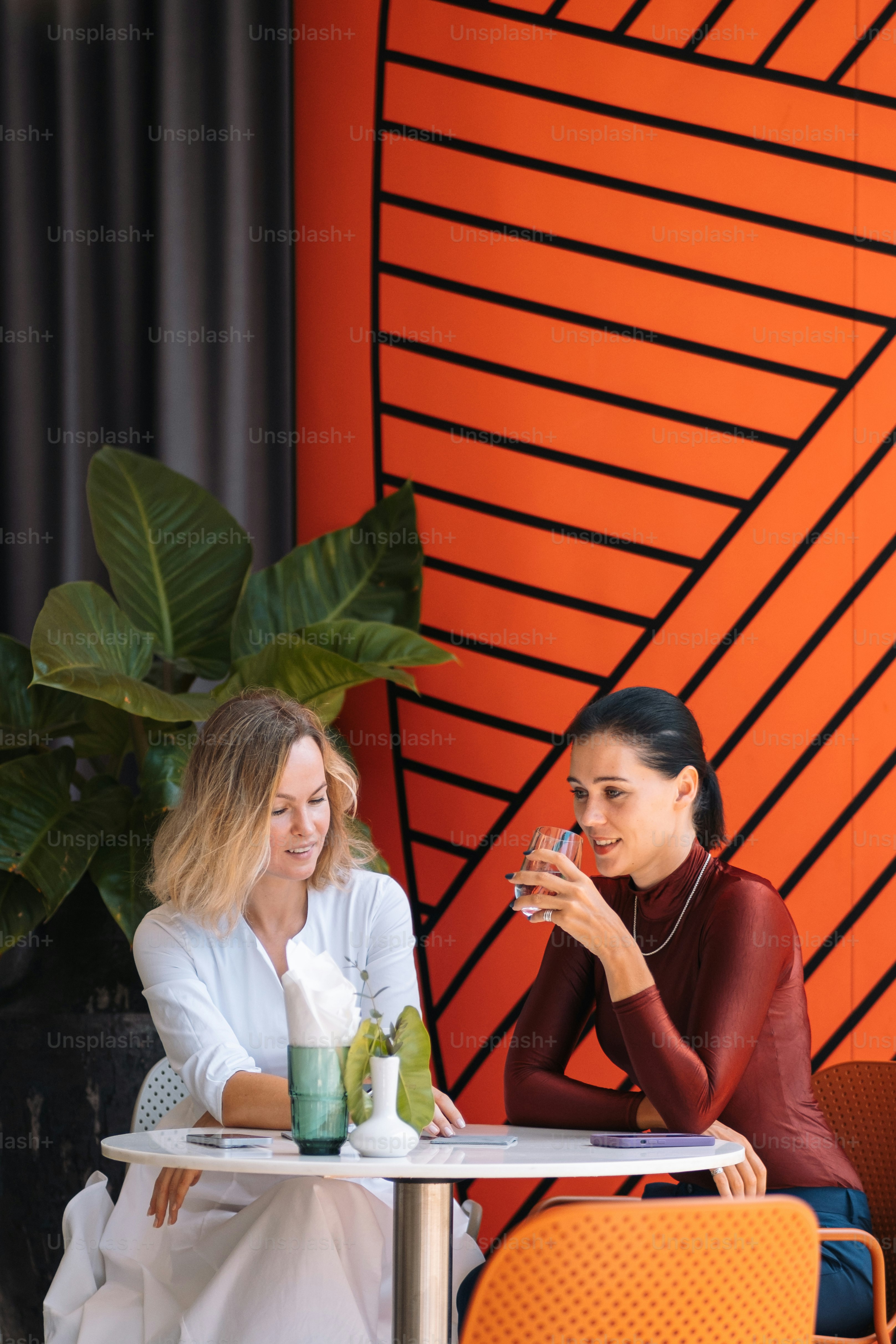 a couple of women sitting at a table