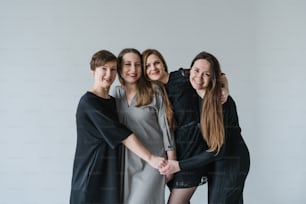 a group of women standing next to each other