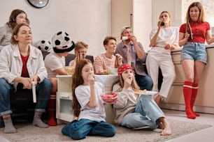 a group of people sitting around eating food