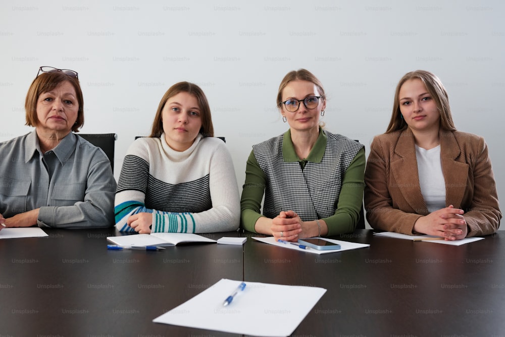 a group of women sitting at a table