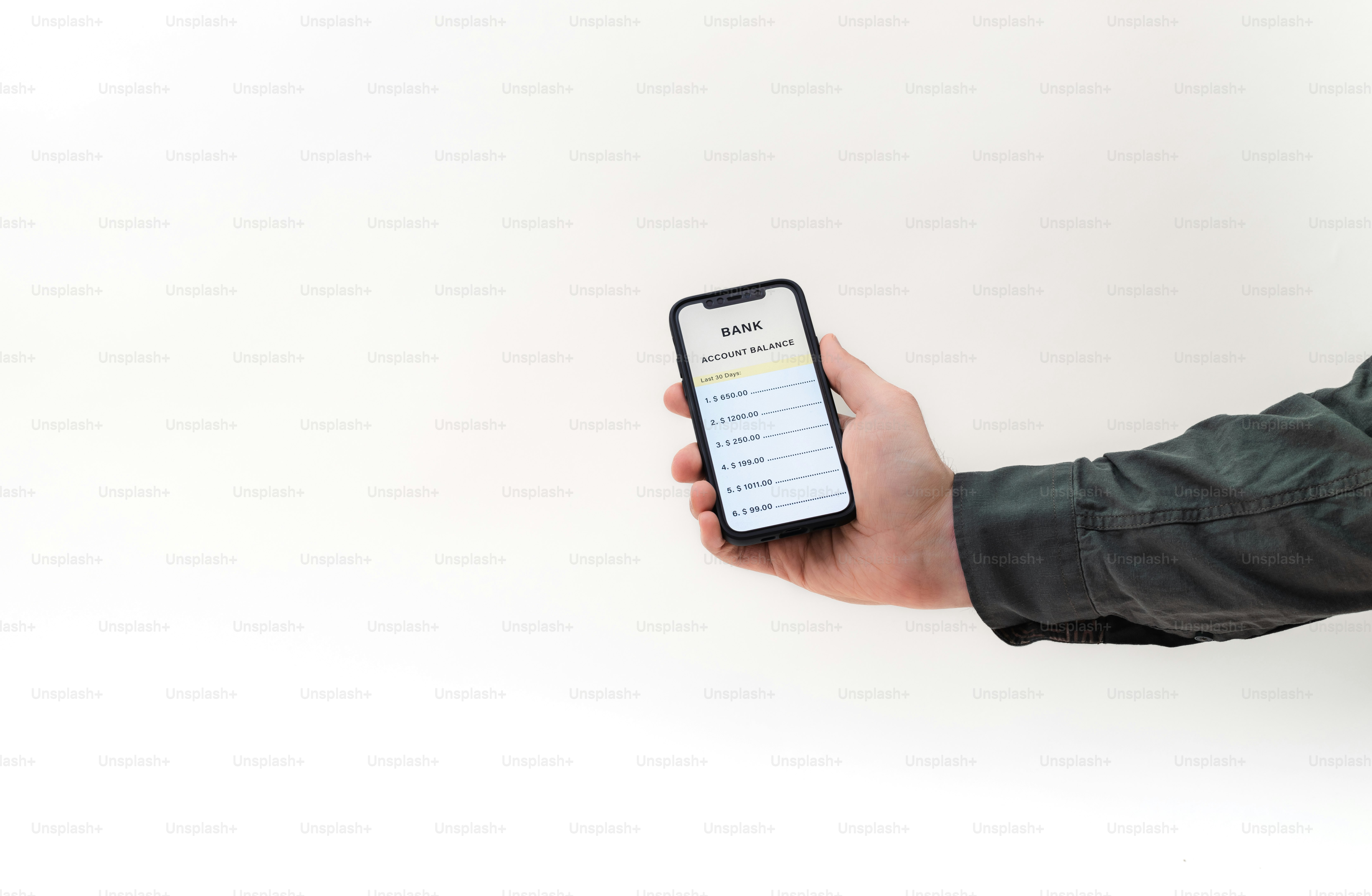 a person holding a smart phone in their hand