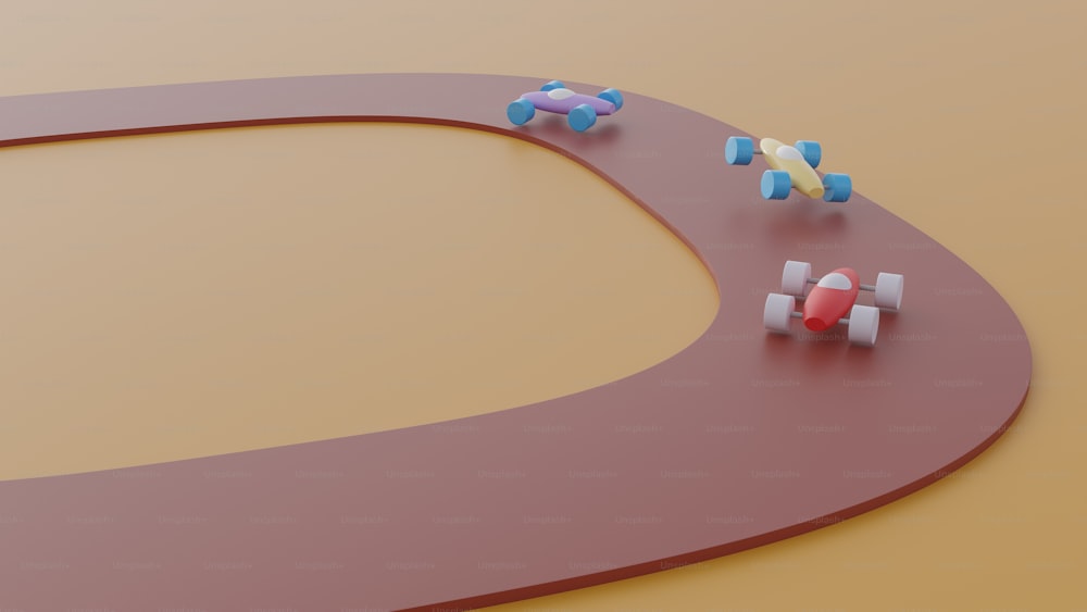a group of toy cars on a curved road