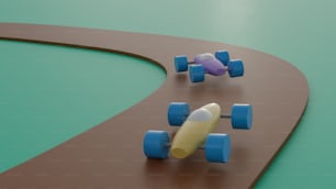 três carros de brinquedo em uma pista com um skate no meio