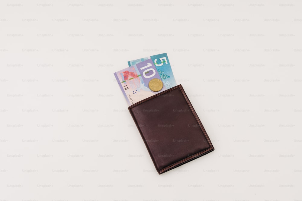 a wallet with a bunch of money sticking out of it