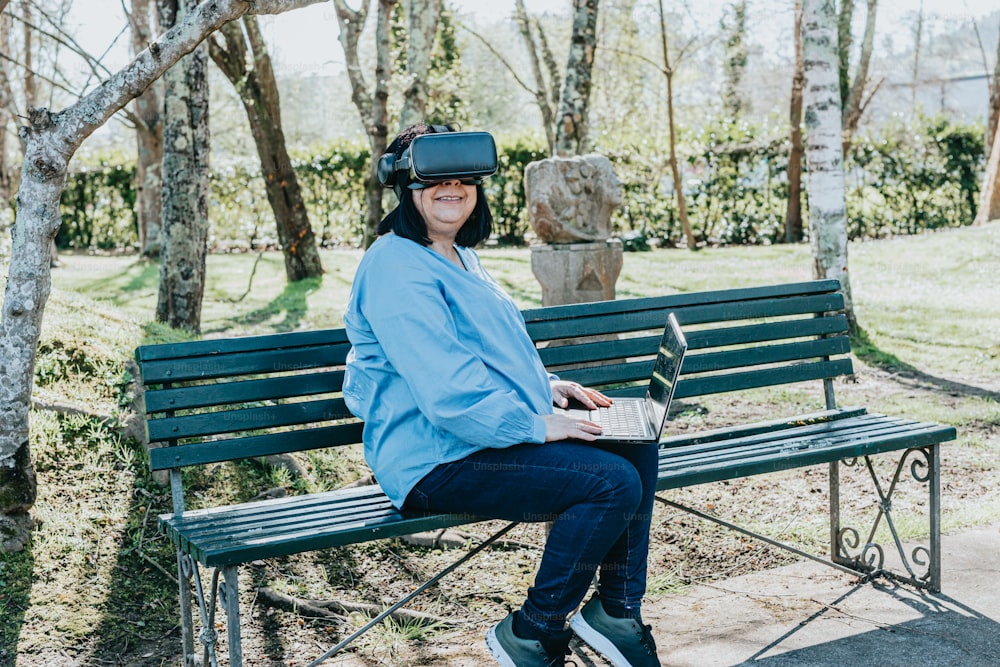 a woman sitting on a bench wearing a virtual headset