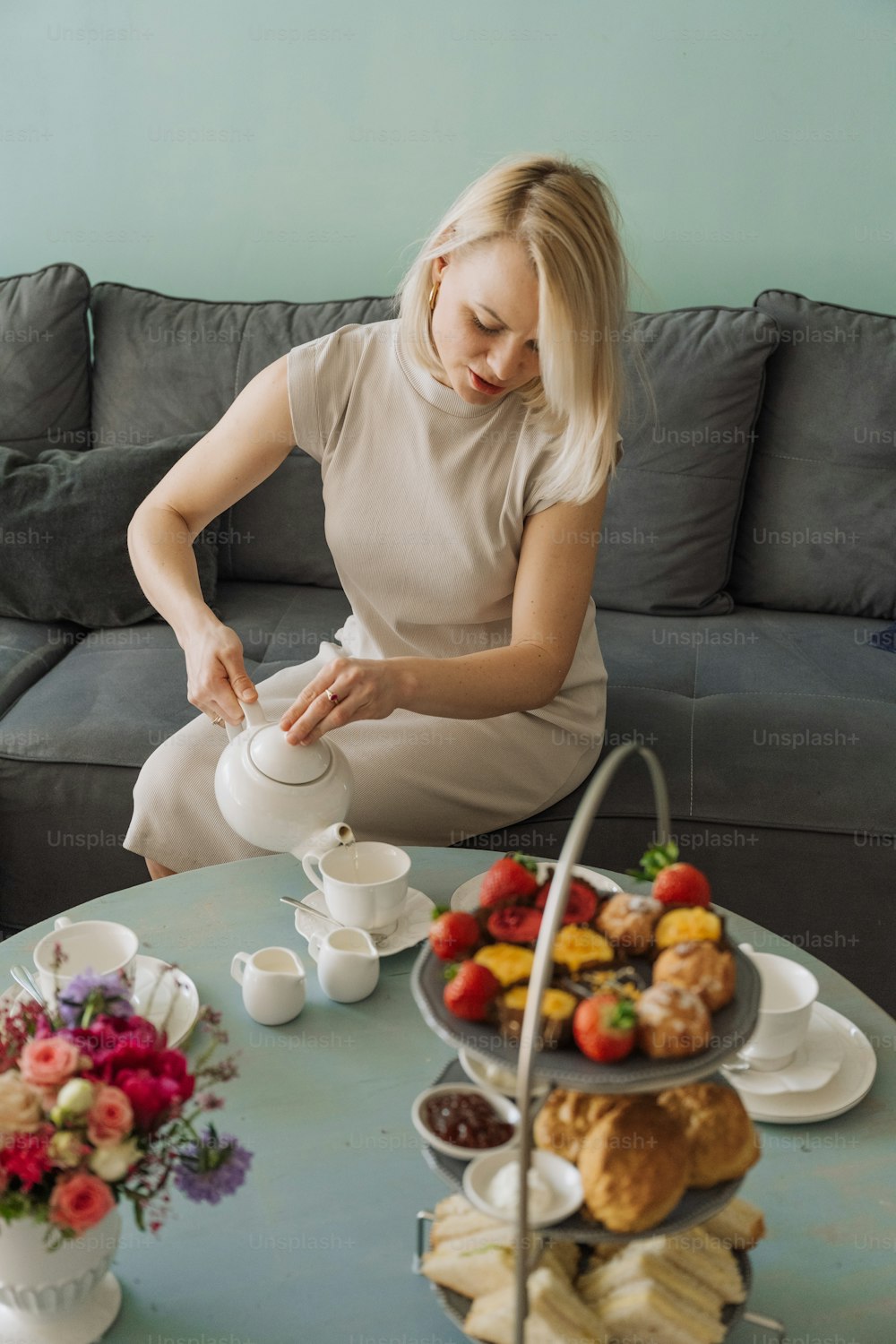 a woman sitting at a table with a tray of food