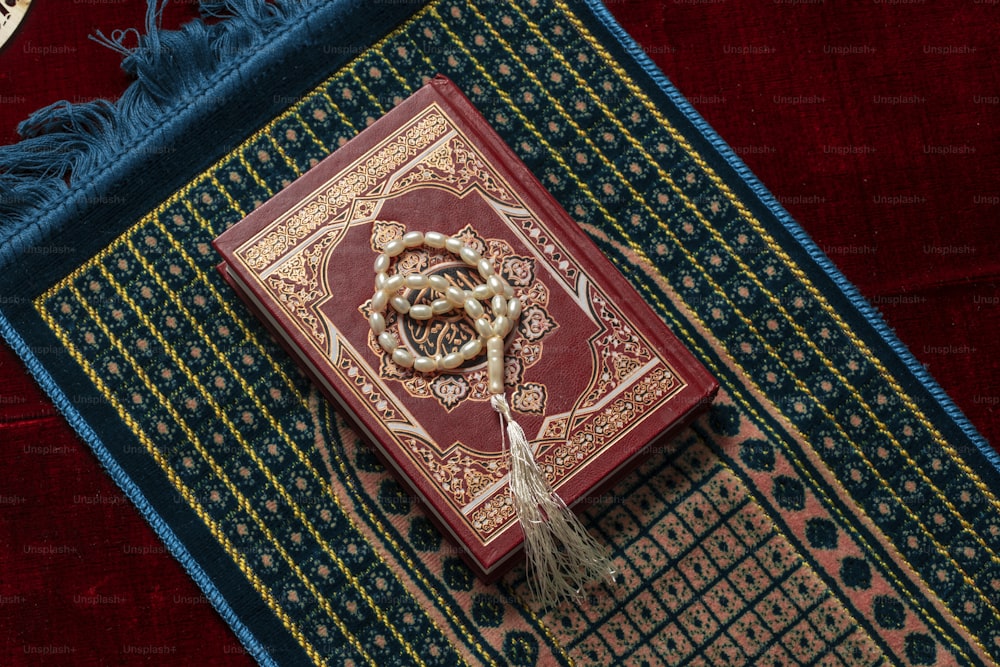 a red book with a snake on top of it