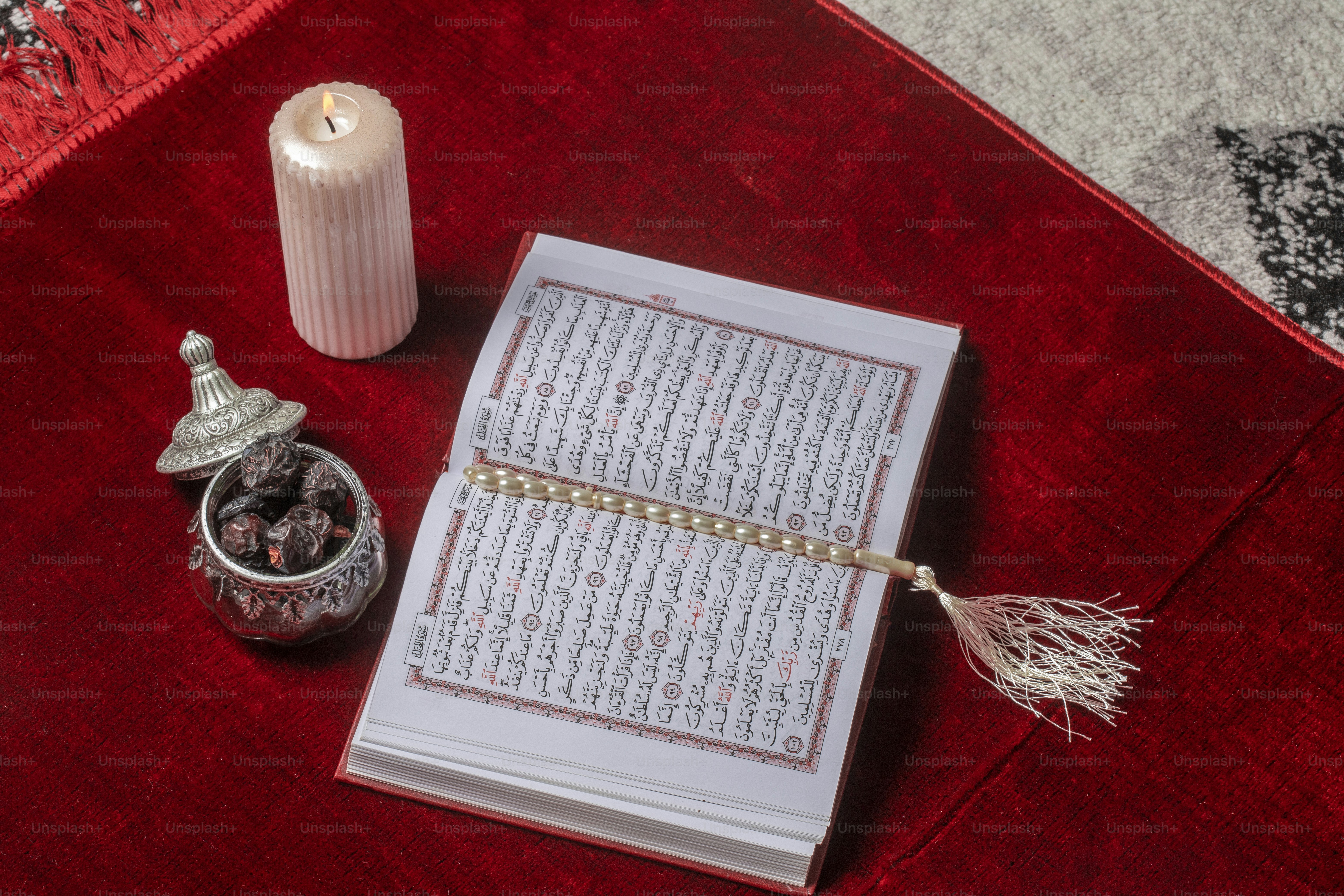 an open book with a tassel on top of it