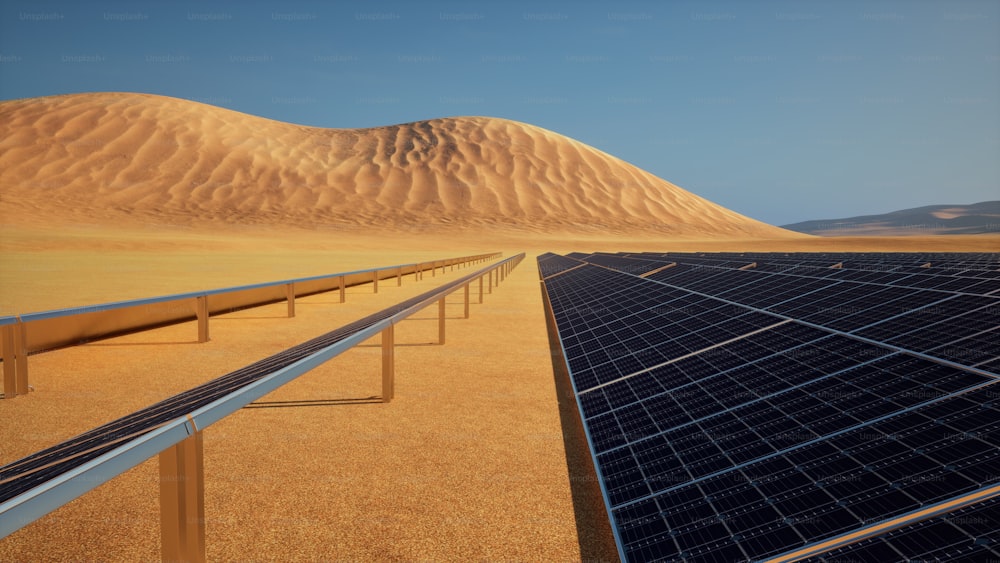 eine Wüste mit Reihen von Sonnenkollektoren im Vordergrund