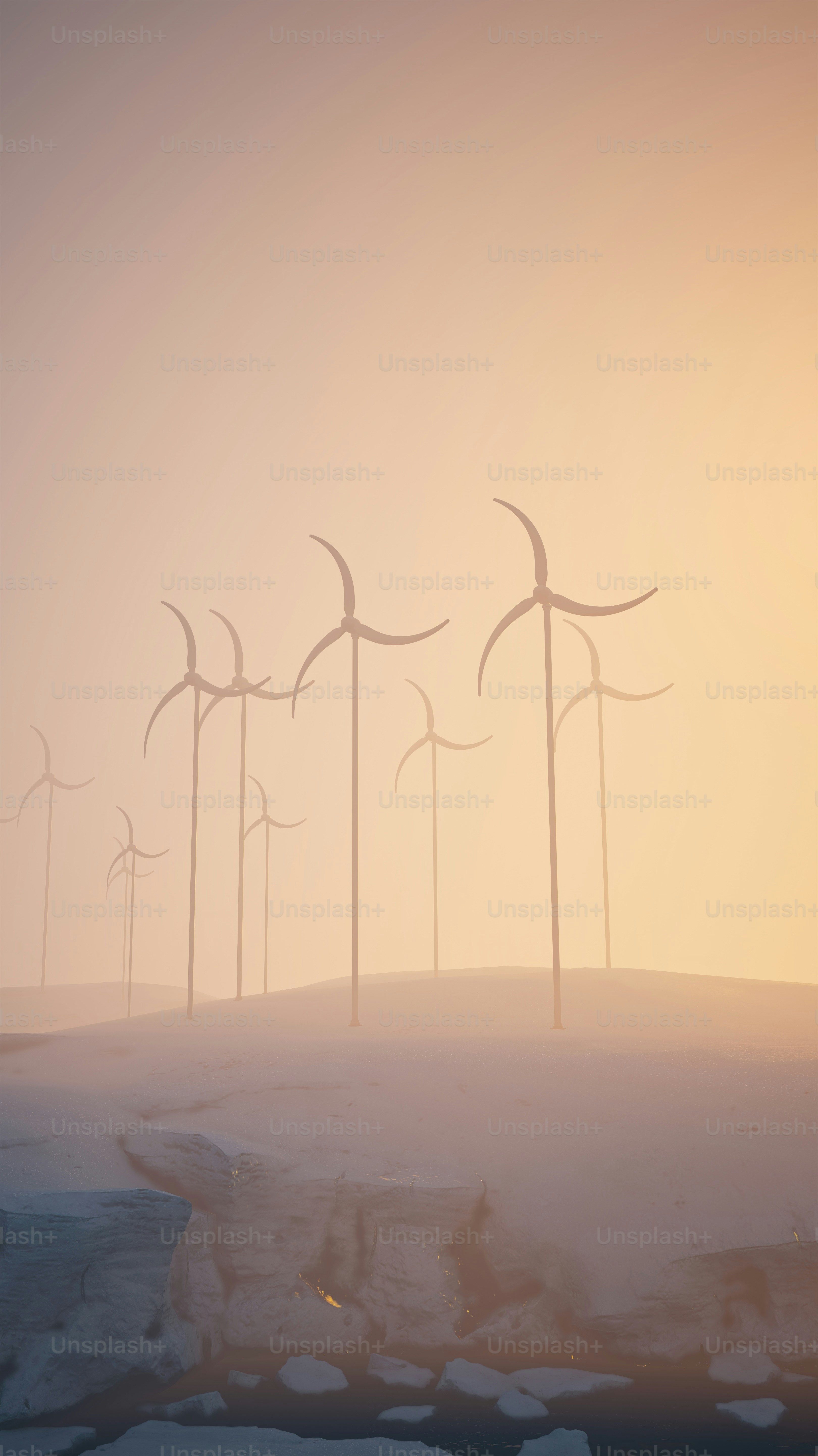 a group of wind turbines on a snowy hill