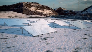 a bunch of solar panels in the snow