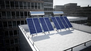 three solar panels sitting on top of a building