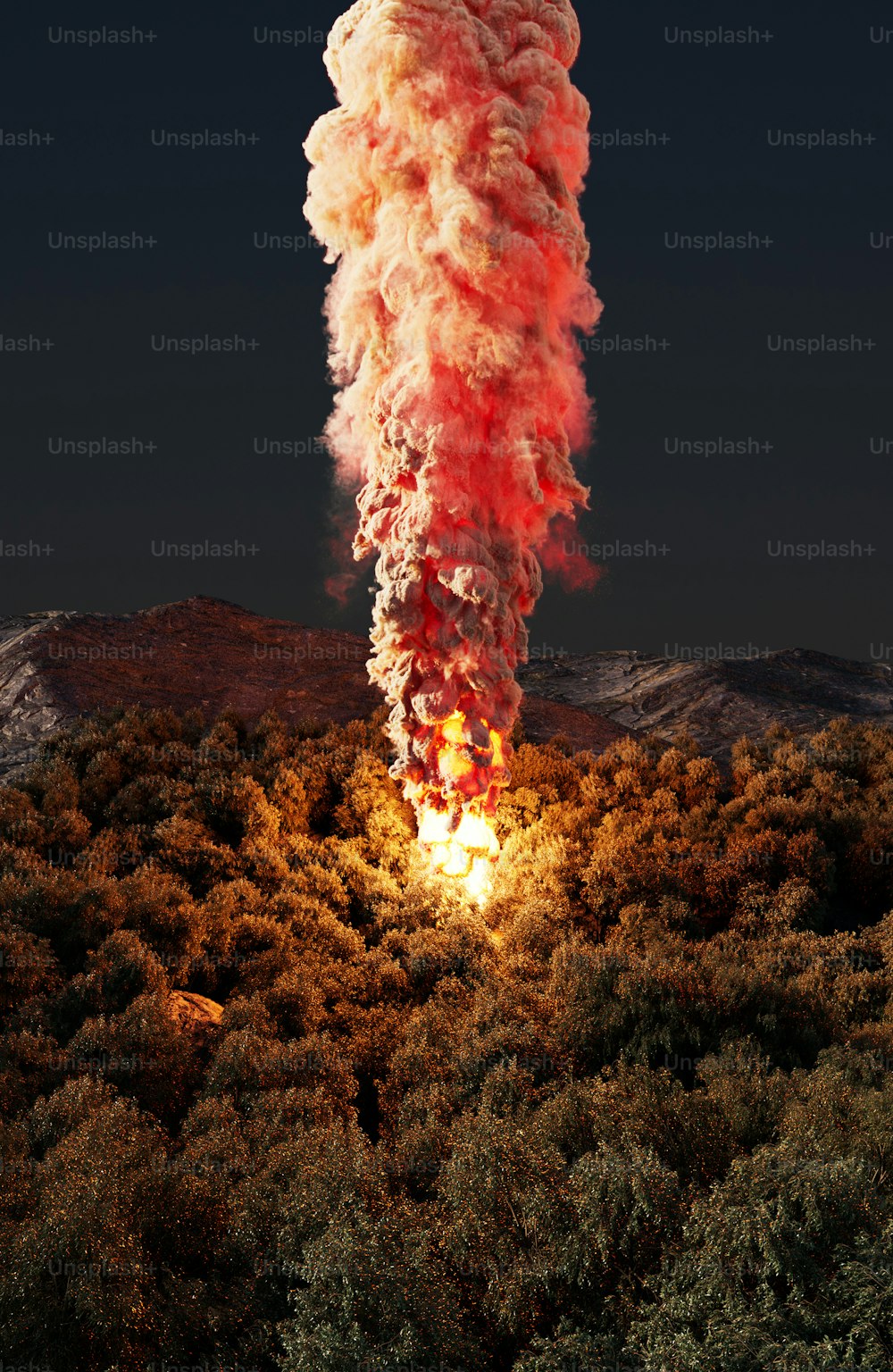 a very large cloud of smoke coming out of the top of a mountain