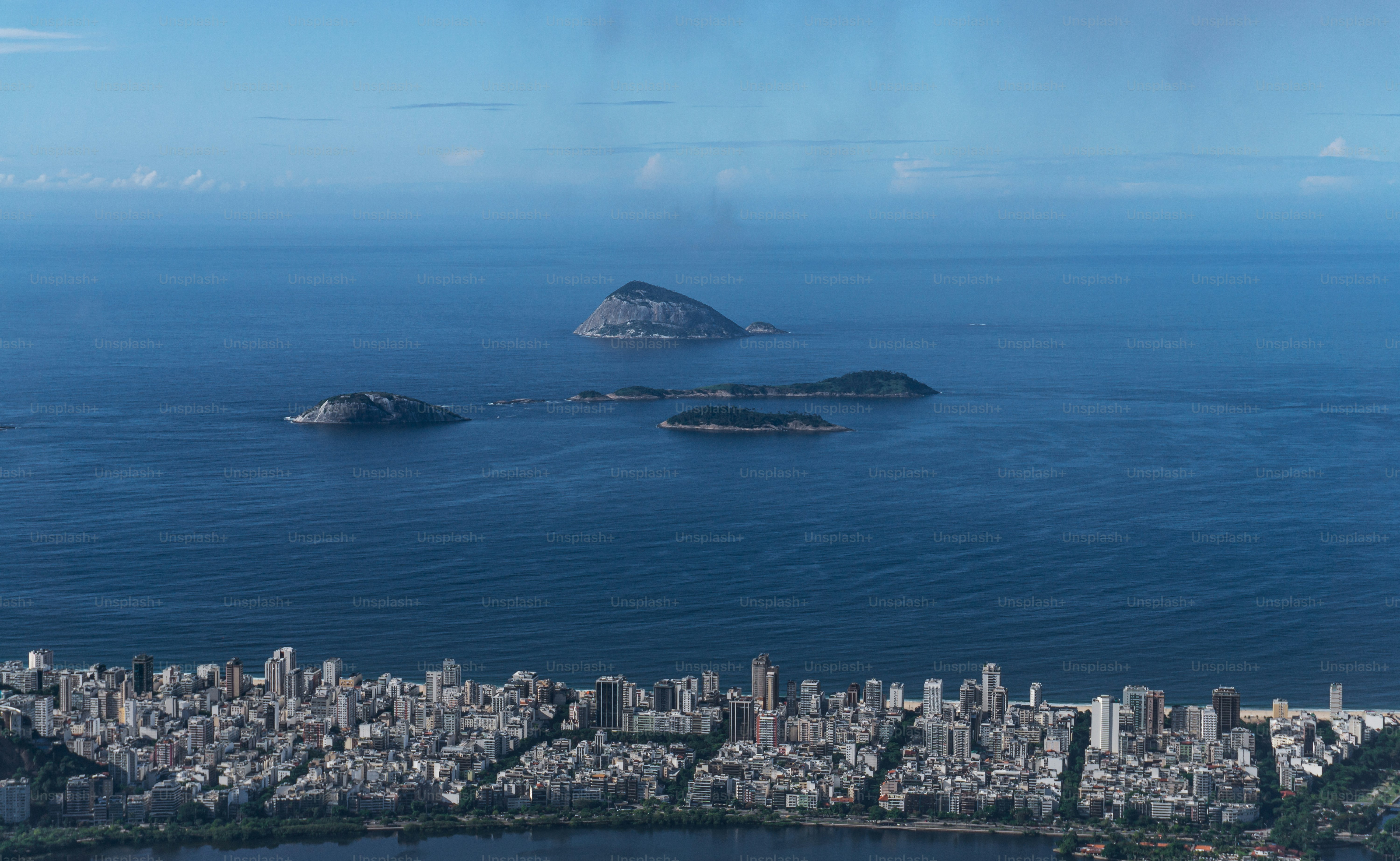 an aerial view of a city and a body of water