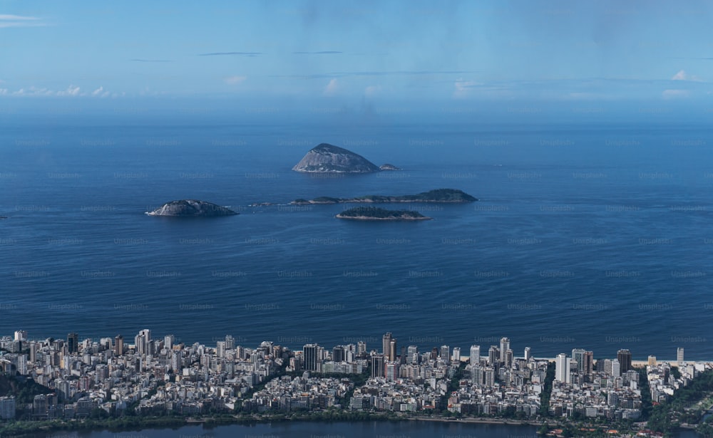 an aerial view of a city and a body of water