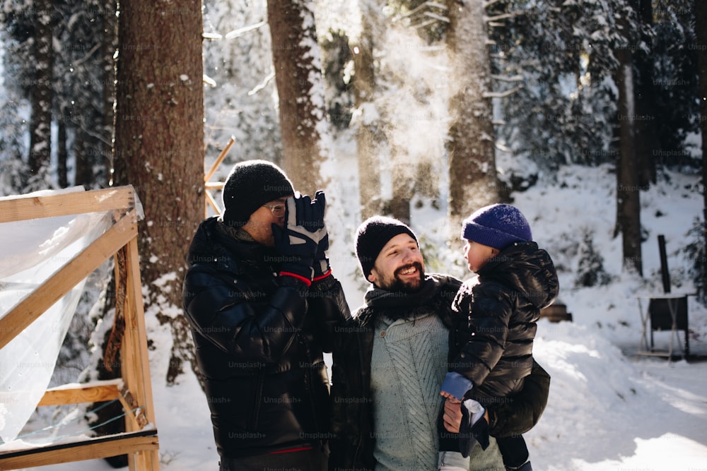 a group of people standing next to each other in the snow