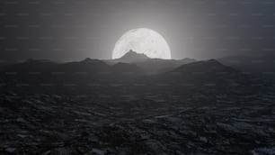 a full moon rising over a mountain range