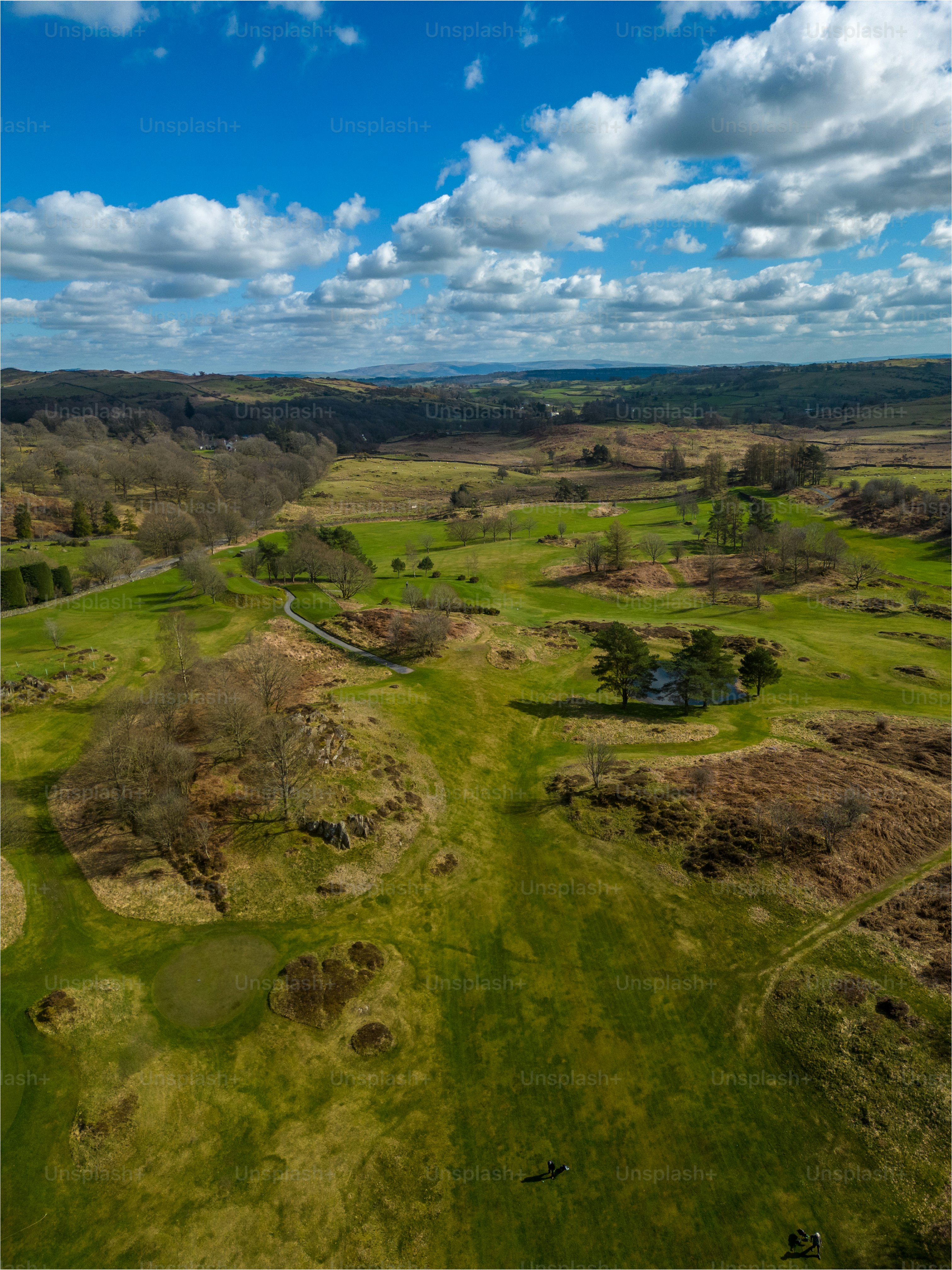 an aerial view of a green golf course