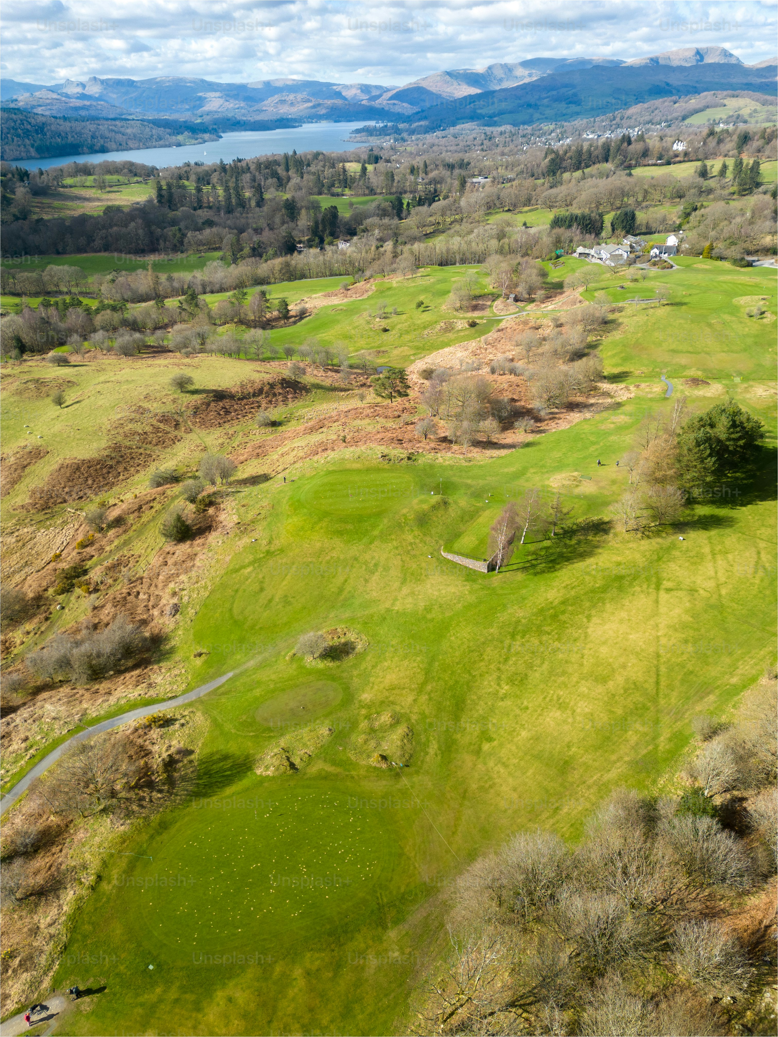 an aerial view of a golf course in the mountains