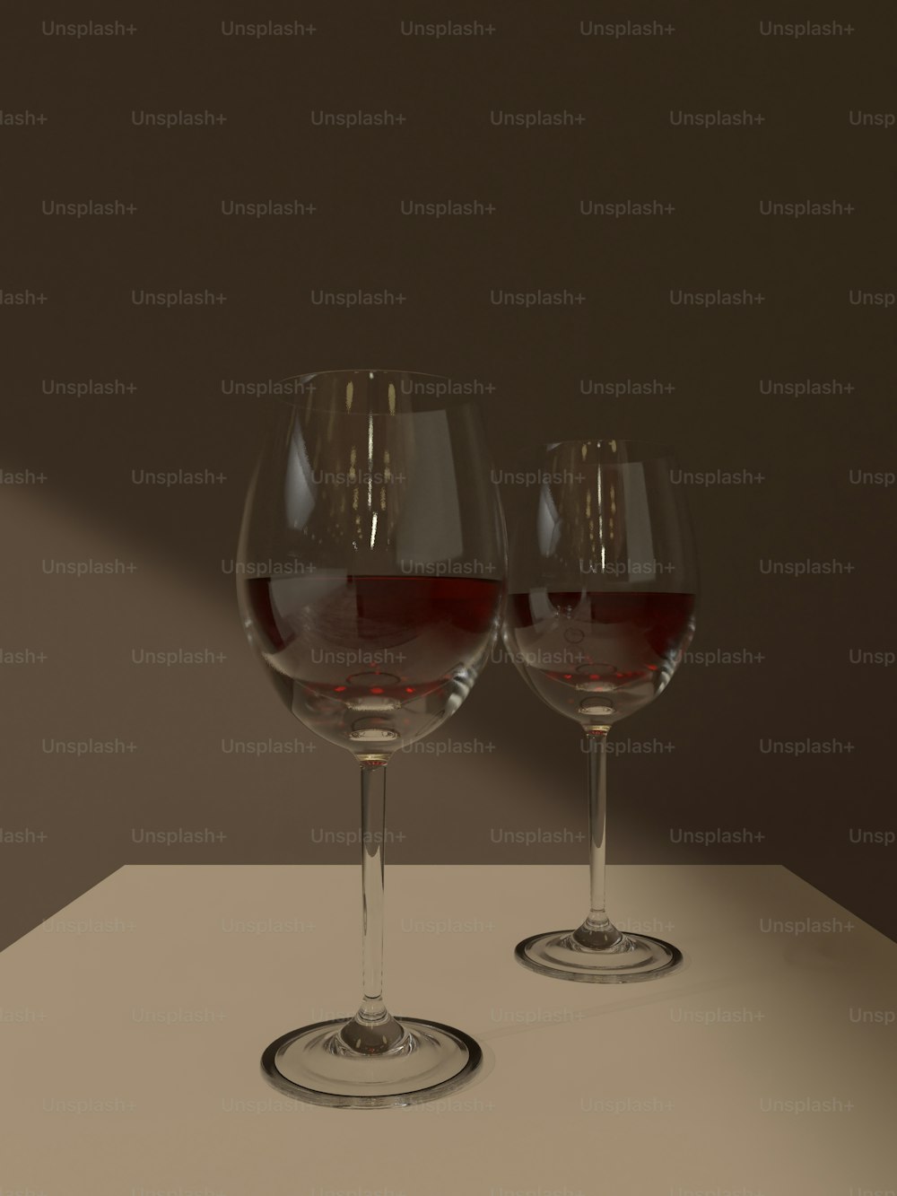 two glasses of wine sitting on a table