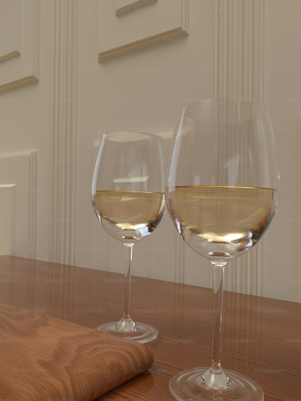 two glasses of white wine on a wooden table