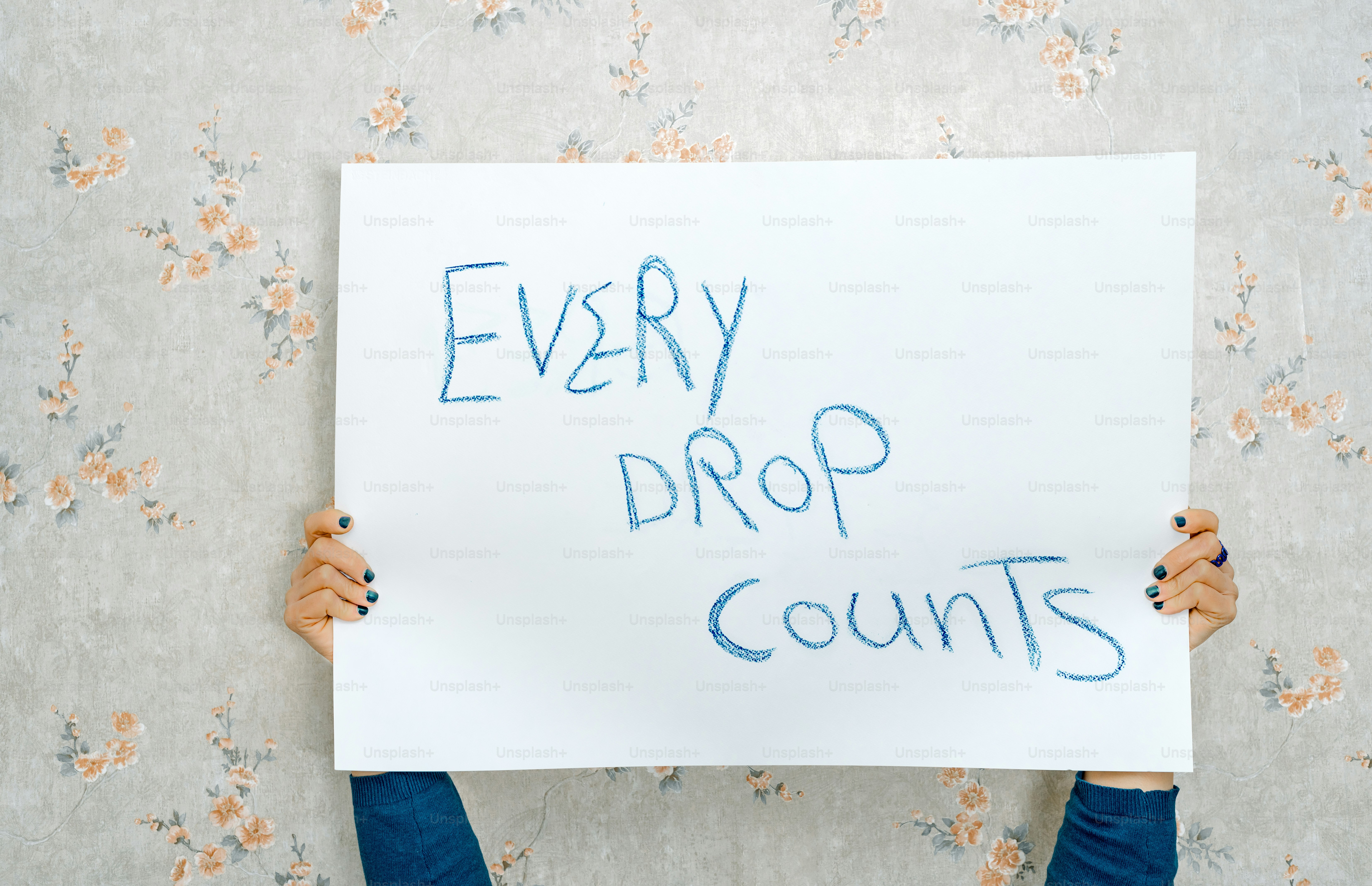 A person holding a sign that says every drop counts photo – Protest ...