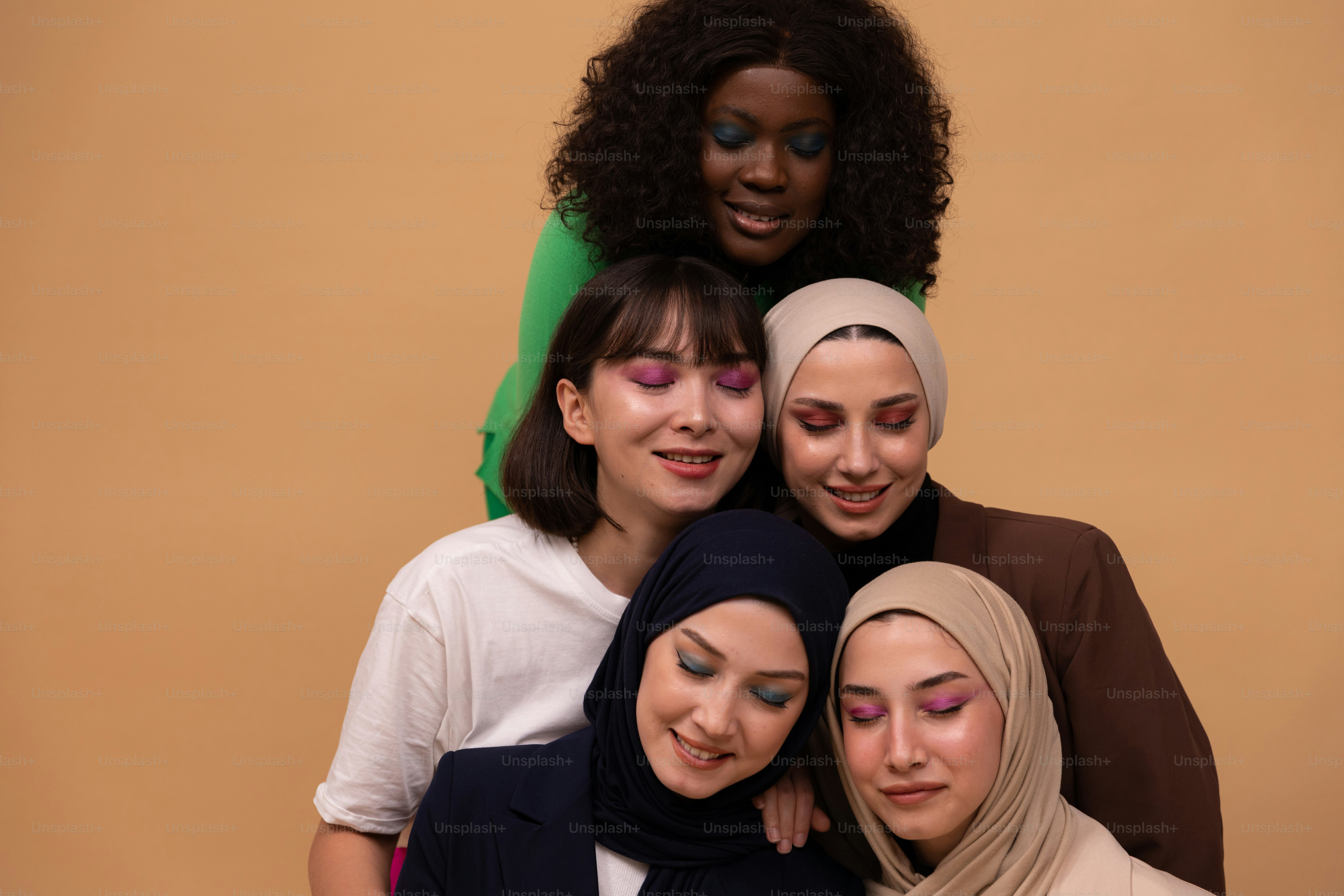 a group of women standing next to each other