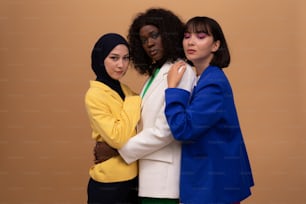 a group of three women standing next to each other