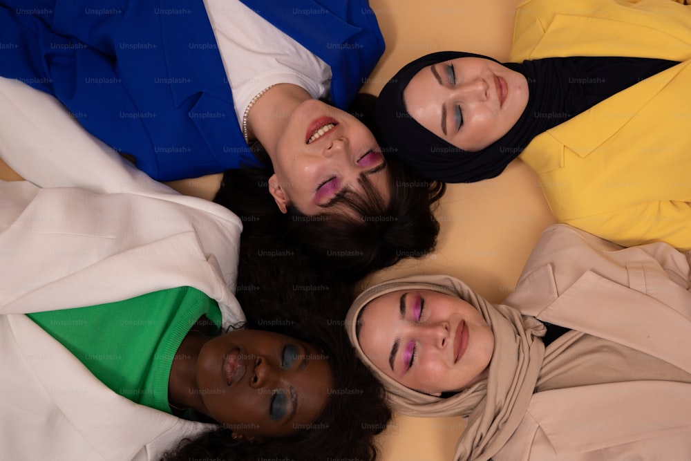 a group of women laying on top of each other