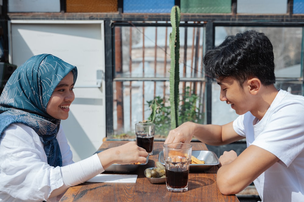 a man and a woman sitting at a table