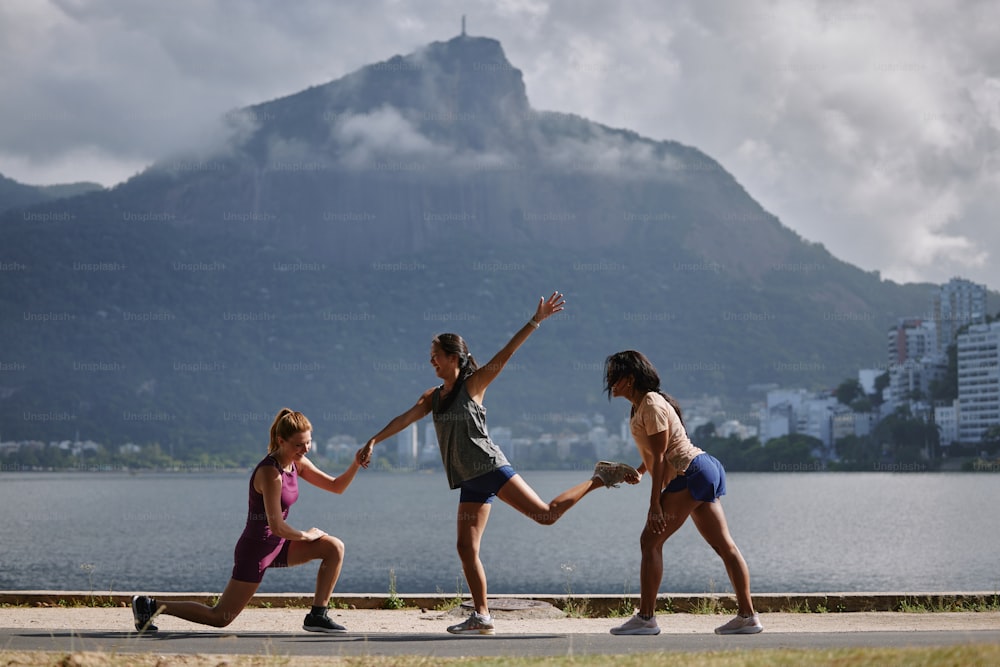 a group of young women playing a game of frisbee