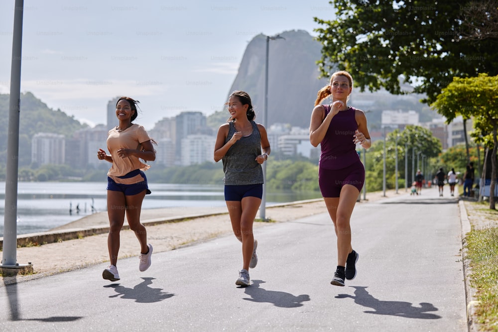 a group of women running down a street
