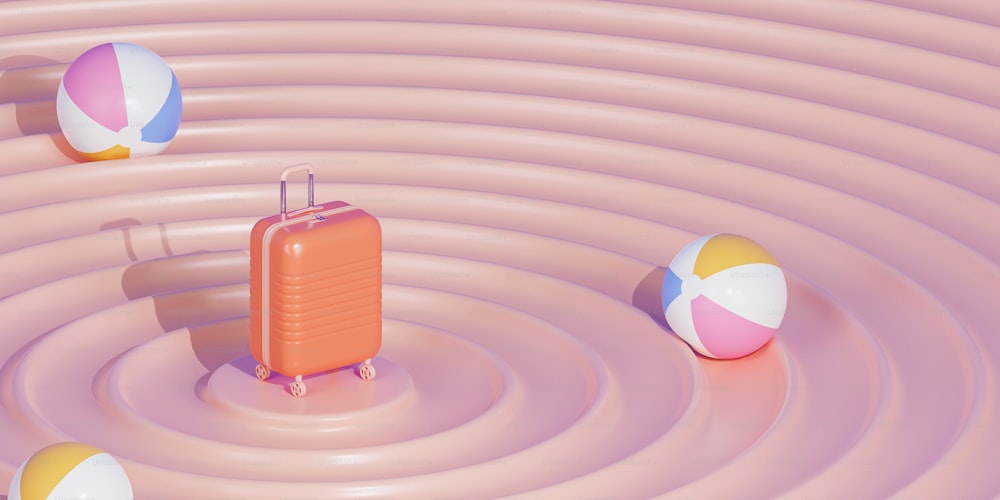 une valise et un ballon de plage flottant dans une piscine d’eau