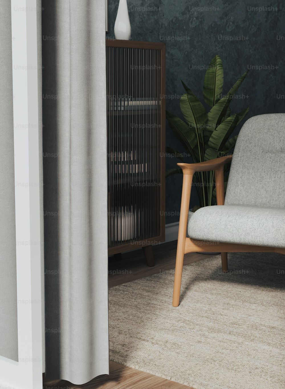 a living room with a chair and a plant