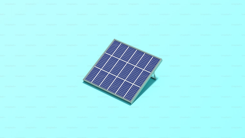 un piccolo pannello solare seduto sopra una superficie blu