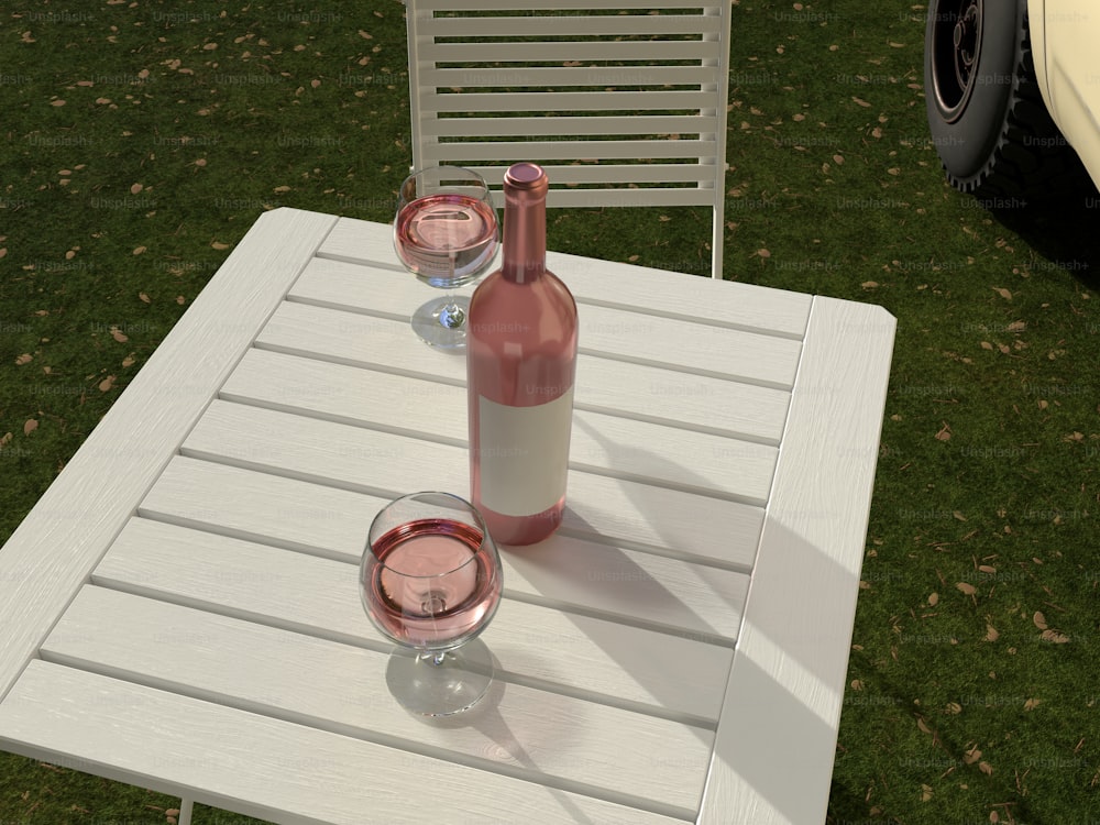 a table with two wine glasses and a bottle of wine