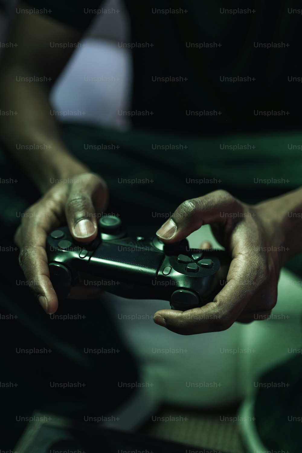 a person holding a video game controller in their hands