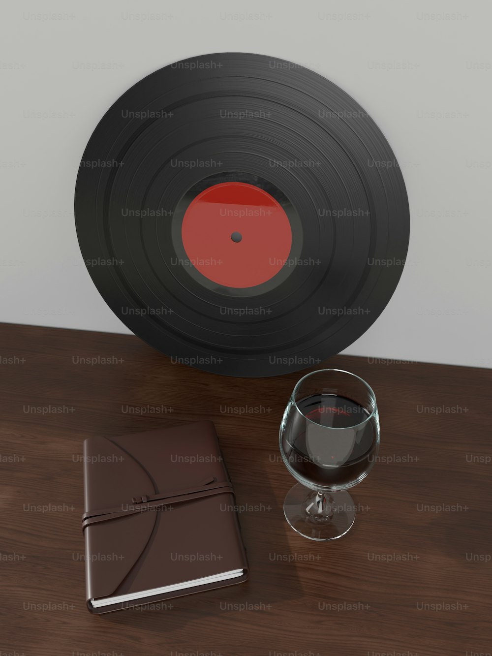 un bicchiere di vino e un libro su un tavolo