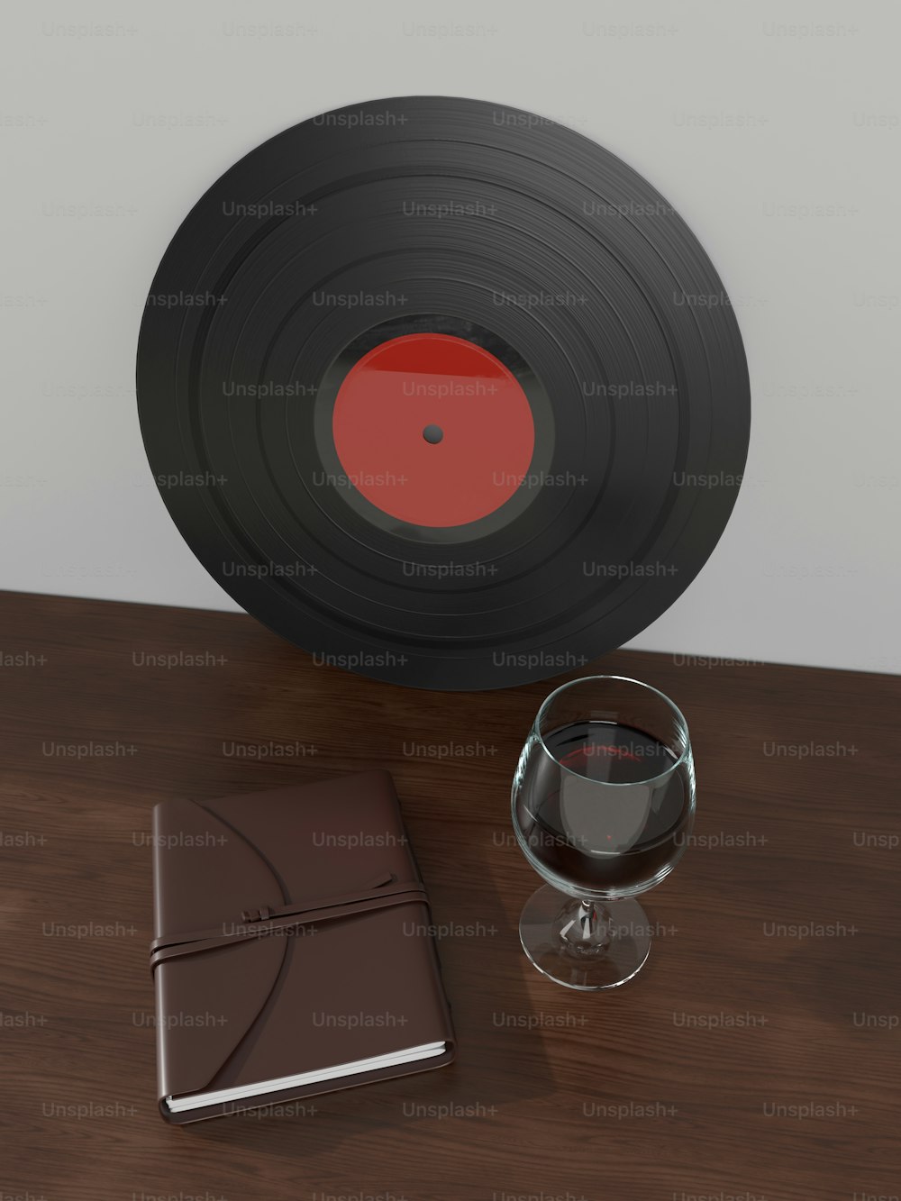 un verre de vin et un livre sur une table