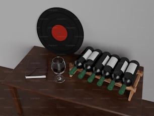 une table en bois surmontée de bouteilles de vin et d’un verre de vin