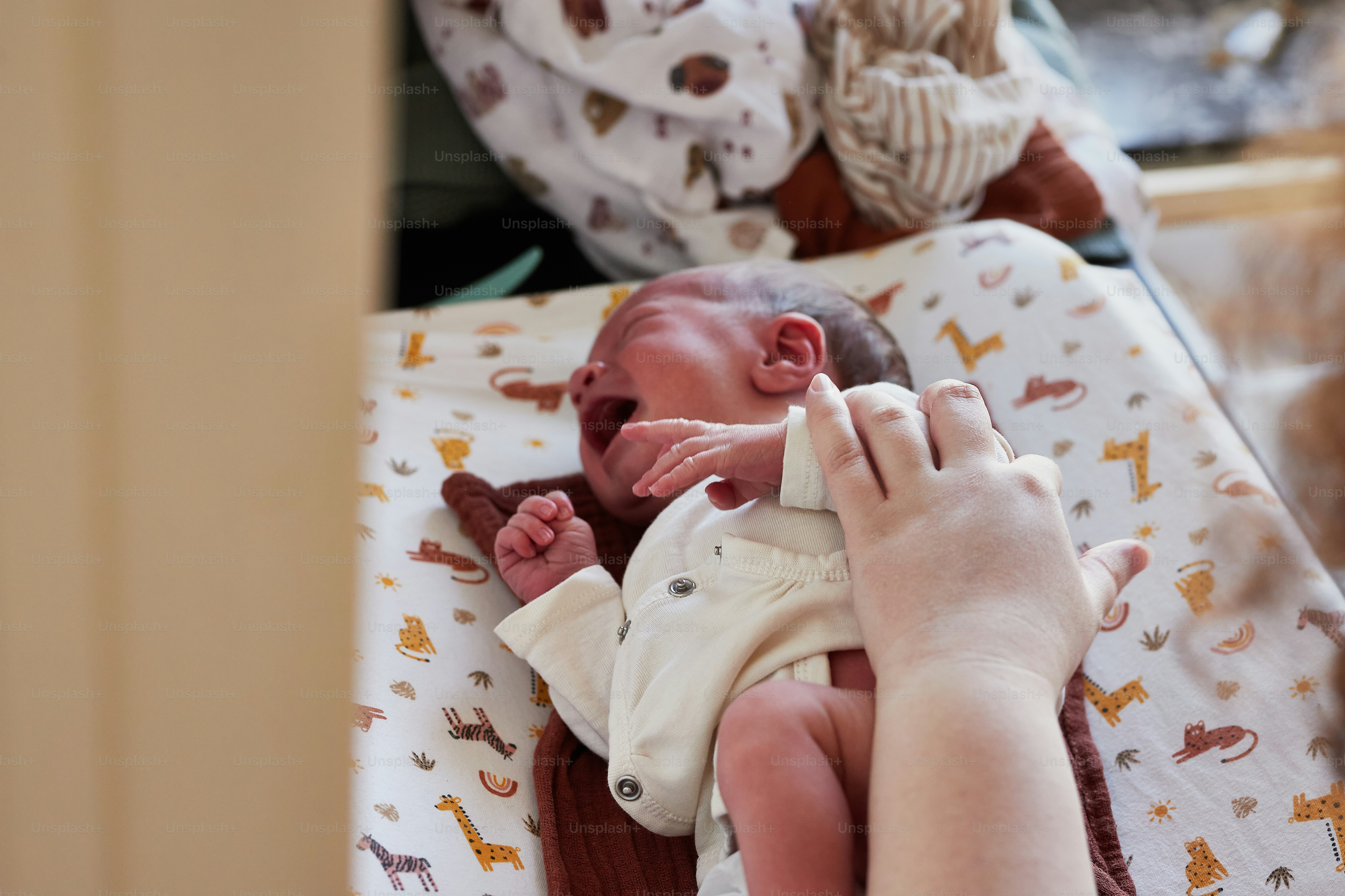 a woman holding a baby in her arms