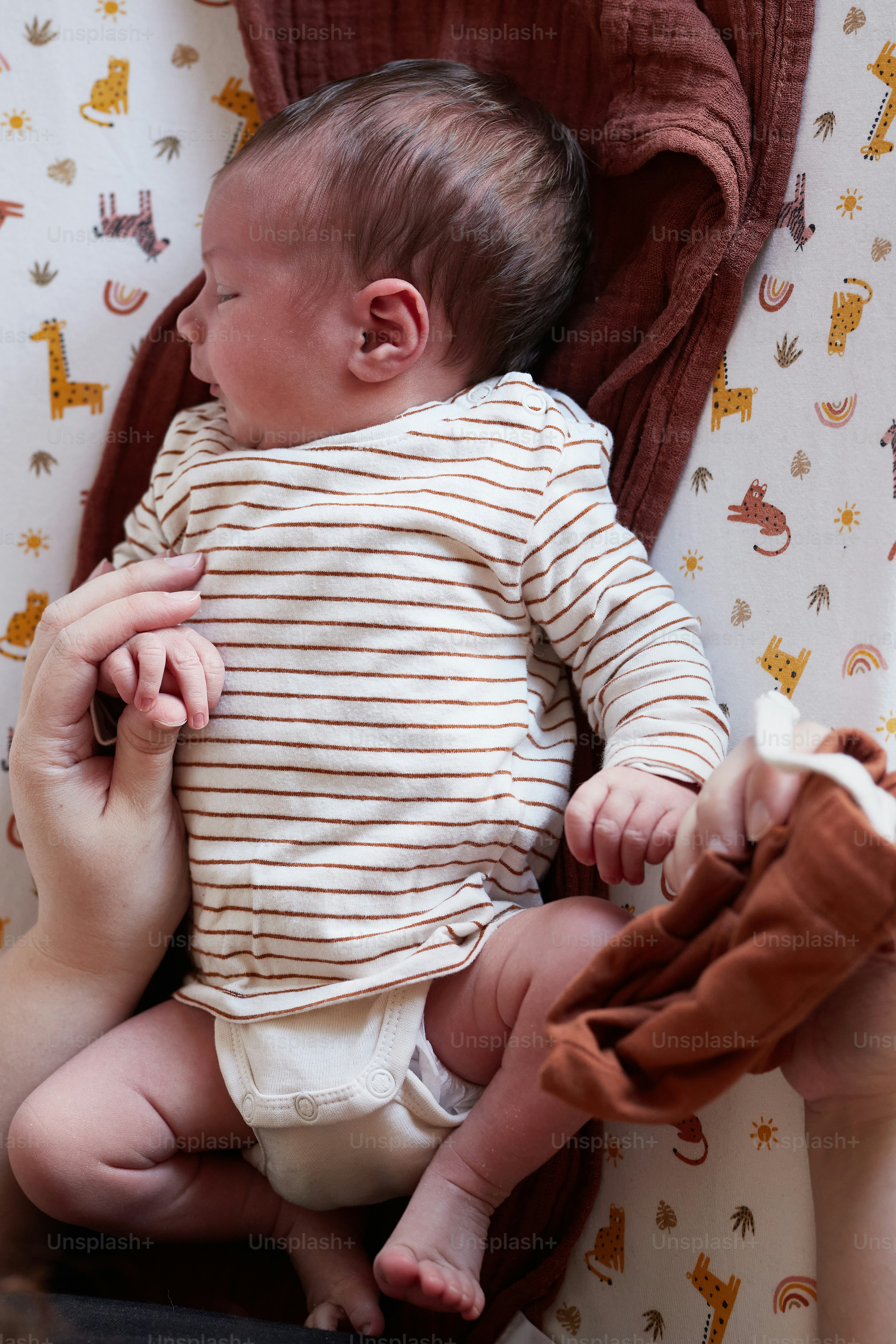 a woman holding a baby in her lap