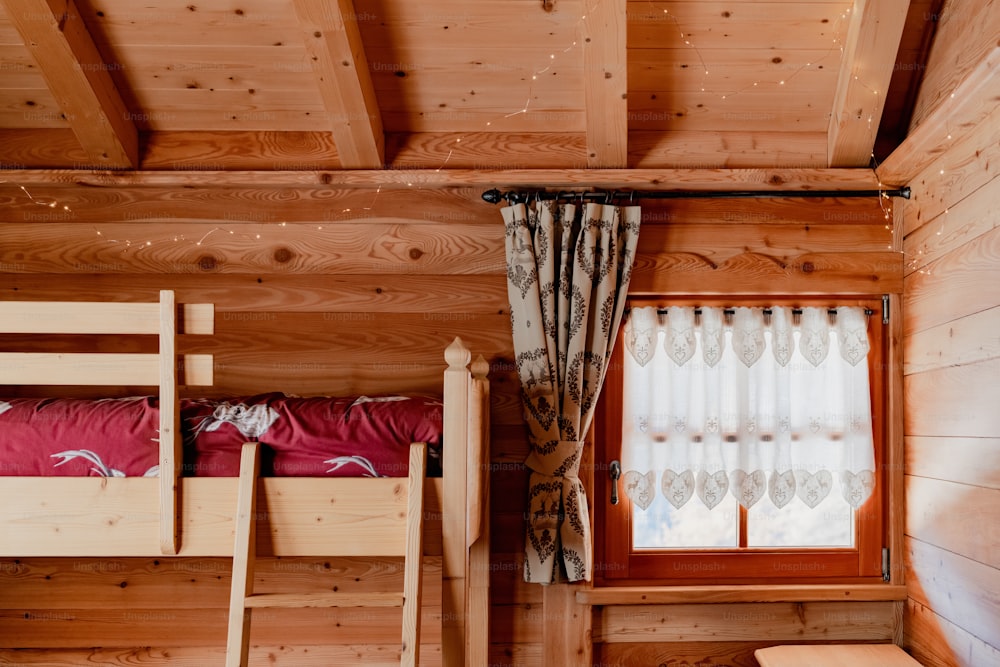 a bedroom with bunk beds and a window