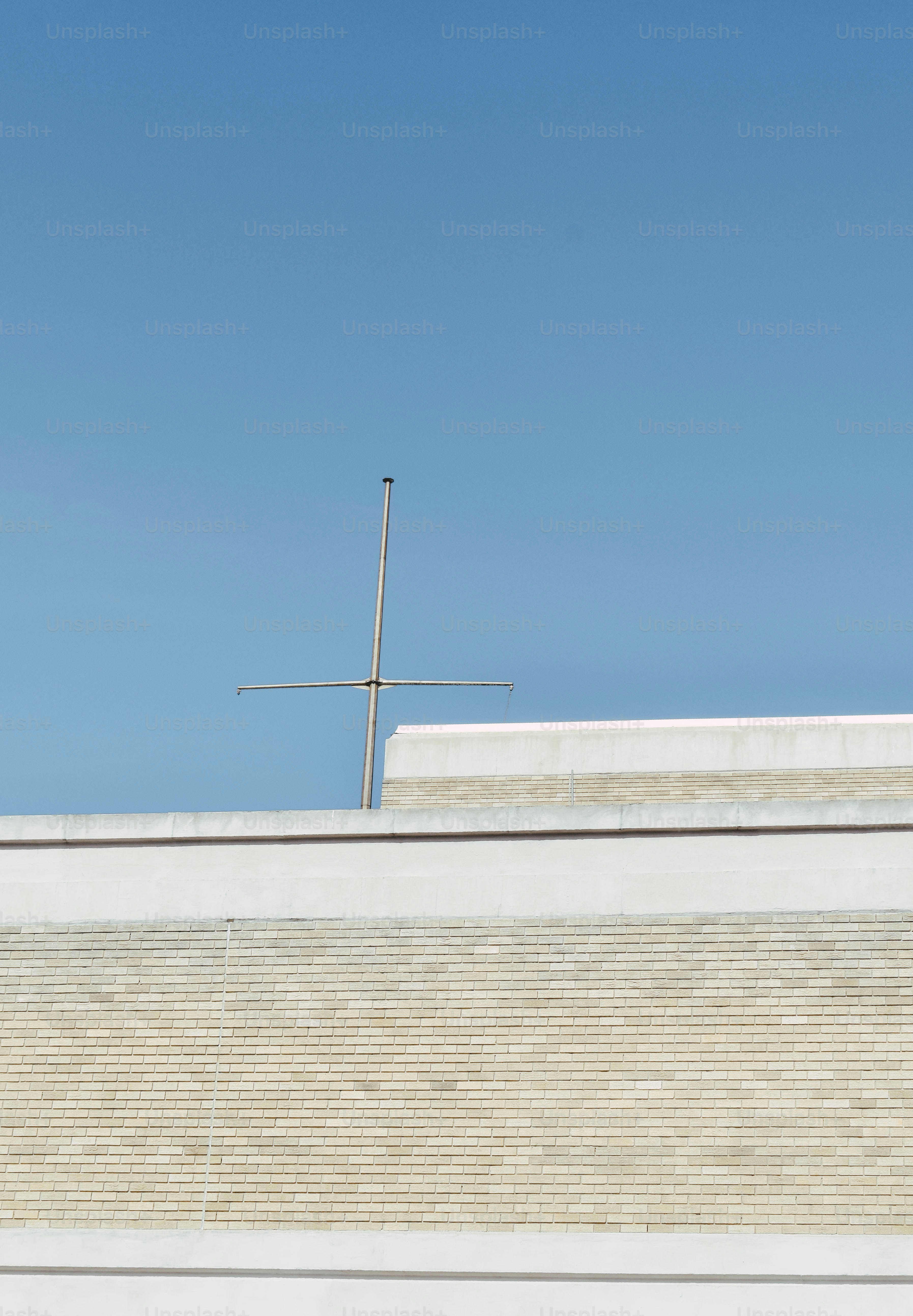 a man riding a skateboard on top of a cement wall